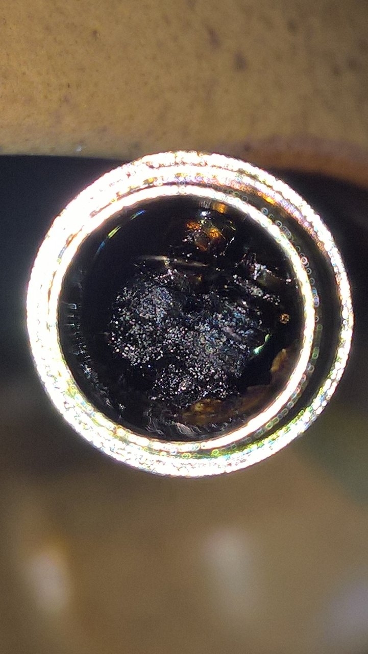 Rosin in a Vertex W3 Concentrates pen, hugging the coils....