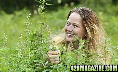 woman-cannabis-plant-207603921.jpg