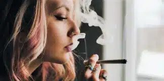 Young woman smoking cannabis Hotels