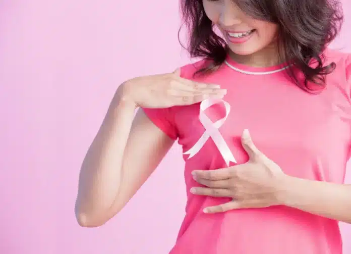 woman with breast cancer ribbon 1 cancer survivor